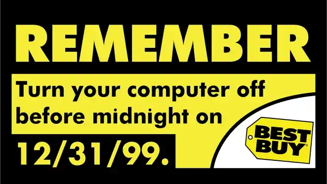 Vintage mainframe computer installation with large cabinet-style units and tape drives in a climate-controlled room