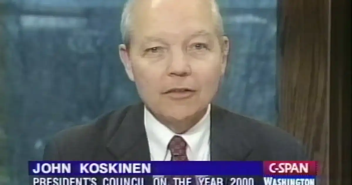 Computer server room with rows of illuminated blue server racks receding into darkness